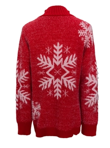 Macro view of the fluffy red knit sweater back featuring a large white snowflake pattern