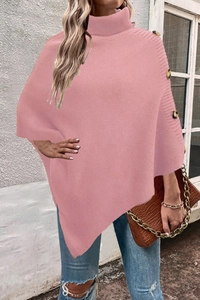 Detail view of pink turtleneck knit poncho sweater featuring decorative gold buttons on shoulder
