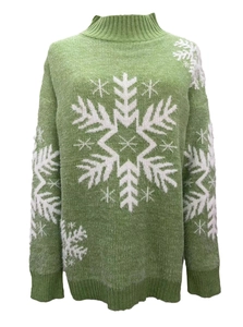 Close-up of green knit Christmas sweater with white snowflake pattern and mock neck