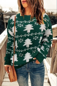 Women's green Christmas sweater with white knit snowflake and tree patterns