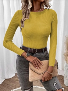 Detailed texture of mustard yellow rib-knit fabric on a women slim-fit crewneck sweater