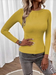 Close-up of mustard yellow knit sweater featuring vertical ribbed texture and crew neck