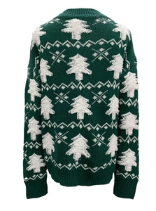 Detail of green Christmas knit sweater showing Nordic tree patterns and ribbed cuffs