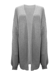 Close-up of chunky knit gray cardigan showing heavy stitch texture and ribbed cuff detail