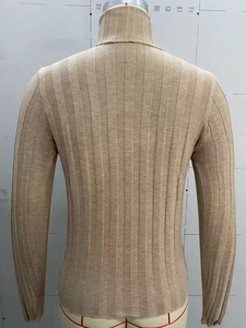 Detail view of the back of a slim-fit camel turtleneck sweater with vertical ribbed texture