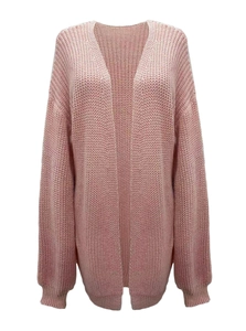 Detailed texture of thick knit fabric on a light pink long cardigan with ribbed cuffs