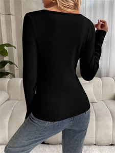 Back view of black slim-fit ribbed knit sweater with a deep V-neck in a home setting