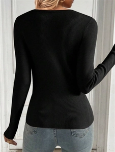 Detailed back view of women's black ribbed knit sweater with slim fit and long sleeves
