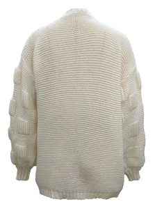 Back view of cream knit cardigan featuring oversized puff sleeves and textured patterns