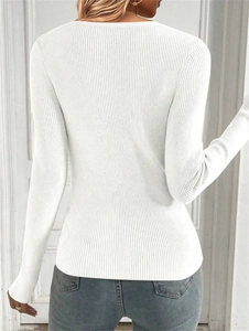 Detail of white long sleeve ribbed knit sweater with slim fit and round neckline from the back