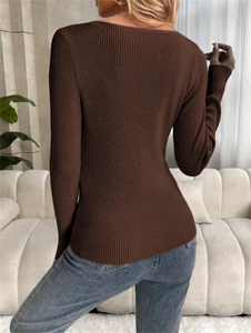 Detail of slim fit dark brown ribbed knit top with long sleeves and a wide round neck