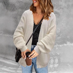 Women's cream chunky knit cardigan featuring drop shoulder lantern sleeves and relaxed fit