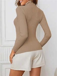 Detail shot of camel ribbed knit turtleneck sweater with long sleeves and slim fit design
