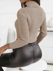 Close-up of beige turtleneck knit sweater with vertical rib texture and back view details