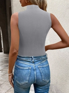 Detail shot of the ribbed knit texture and turtleneck design on this grey sleeveless top