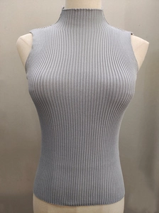Detailed view of grey mock neck sleeveless vest featuring vertical ribbed knit texture