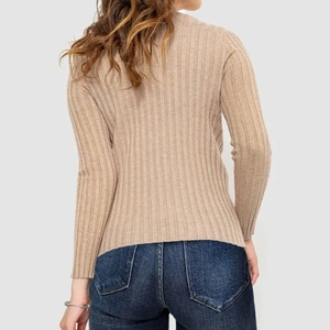 Rear view of a beige ribbed knit sweater for women paired with dark blue jeans