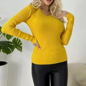 Detail of a bright yellow V-neck ribbed knit sweater with textured long sleeves and cuffs