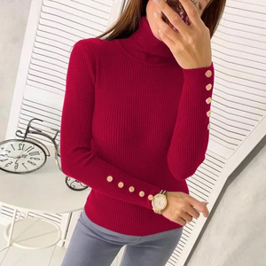 Detailed close-up of golden metal buttons on burgundy ribbed turtleneck knit sweater sleeves