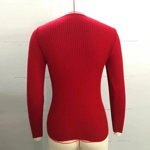 Detailed back view of red ribbed knit long sleeve sweater with subtle vertical texture
