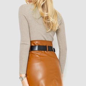 Detail view of the beige ribbed knit sweater paired with a caramel PU skirt and belt