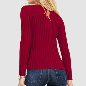 Detail of burgundy rib-knit texture and slim fit design on this long sleeve sweater