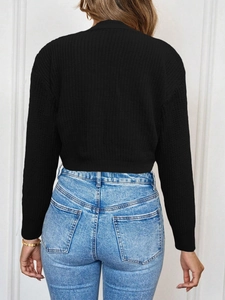 Close-up back view of black ribbed knit cardigan with fitted long sleeve silhouette