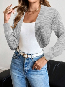 Close-up of grey chunky knit cropped cardigan with textured open-front design