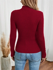 Close-up back view of dark red ribbed knit sweater with high neck and long sleeves