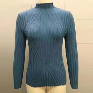 Detail of dark blue rib-knit sweater showing vertical stripes and stand collar texture