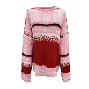 Women's knit Christmas sweater with colorful geometric patterns and striped sleeves