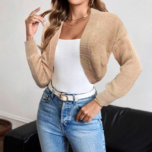 Women's autumn knit cardigan in apricot color with drop shoulders and long sleeves