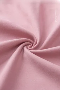 Detail of pink silver ion fabric showing soft, smooth texture and breathable mesh weave