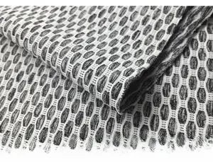 Macro shot of high-waist yoga shorts featuring honeycomb textured 3D compression fabric