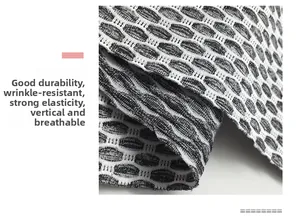 Close-up of honeycomb textured yoga shorts fabric with breathable knit details