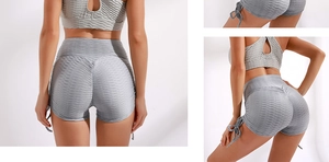 Detail view of honeycomb textured grey yoga set with adjustable side drawstrings and high waist