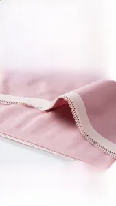 Detailed close-up of soft pink maternity cotton briefs featuring delicate lace trim edging