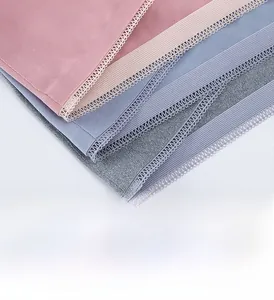 Detailed view of breathable cotton fabric with delicate lace edges and ribbed elastic bands