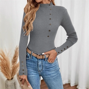 Slim fit grey ribbed knit sweater for women with decorative buttons and a mock neckline