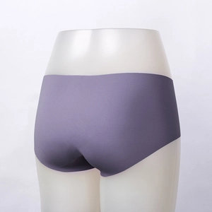 Detail view of purple seamless briefs on a mannequin showing the smooth butt-lifting fit