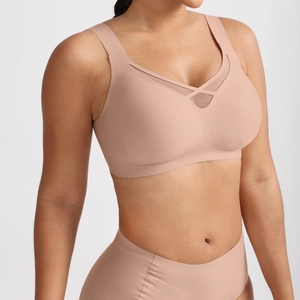 Detail of seamless nude wireless bra and high-waisted briefs with mesh stitching