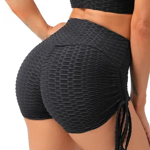 Detail of high waist yoga shorts with honeycomb texture, scrunch butt and side drawstrings