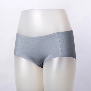 Detail view of seamless grey high-waisted briefs with laser-cut edges on a mannequin