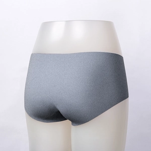 Detail view of grey seamless panties featuring laser-cut edges and elastic fabric texture
