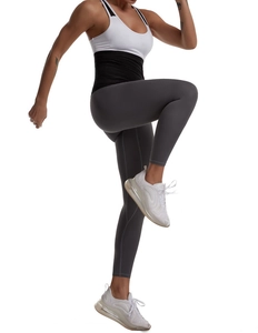 Close-up of the high-waist waist trainer design on fitness leggings for tummy control