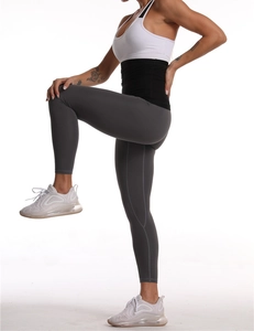 Detail showing high-elasticity grey yoga leggings with compression waistband and flatlock seams