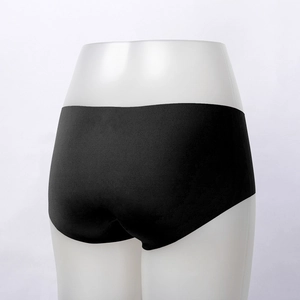 Detail view of seamless black silver ion antibacterial panties on a white torso mannequin