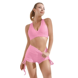 Pink two-piece yoga set with honeycomb texture V-neck vest and high waist drawstring shorts