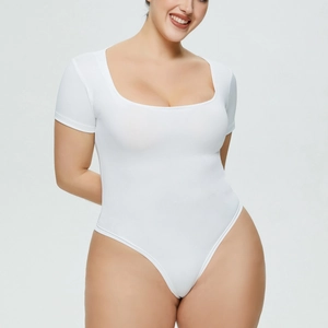 Detail view of the square neckline and snug fit on a white short sleeve bodysuit