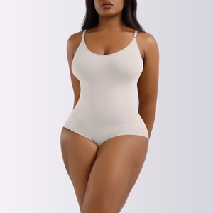 Detailed close-up showing the vertical ribbed texture on the beige shapewear bodysuit